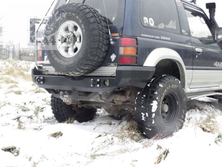 Rear bumper, short version with flares Mitsubishi Pajero II 91-99