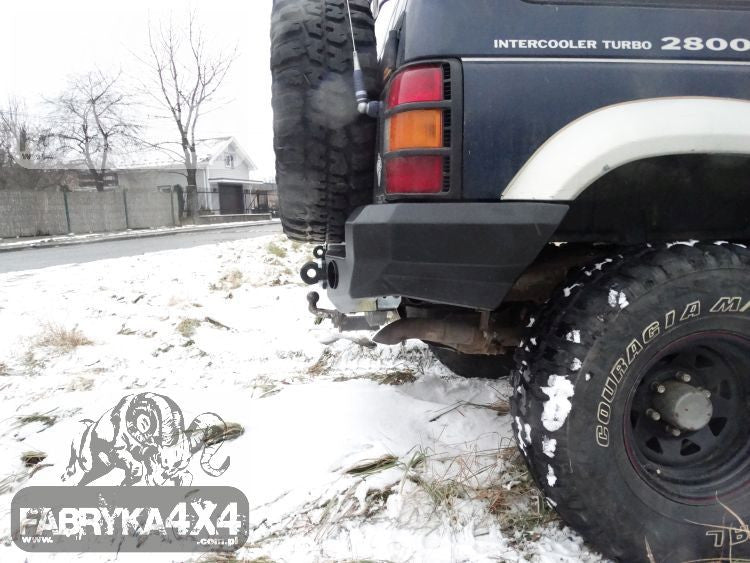 Rear bumper, short version with flares Mitsubishi Pajero II 91-99