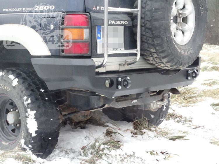 Rear bumper, short version with flares Mitsubishi Pajero II 91-99