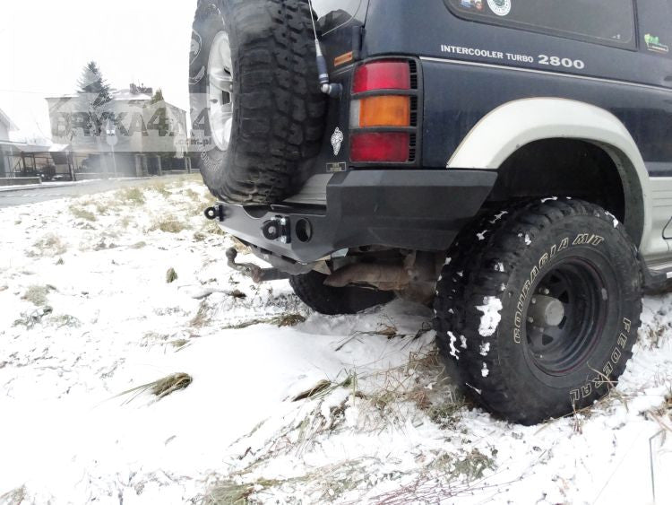 Rear bumper, short version with flares Mitsubishi Pajero II 91-99