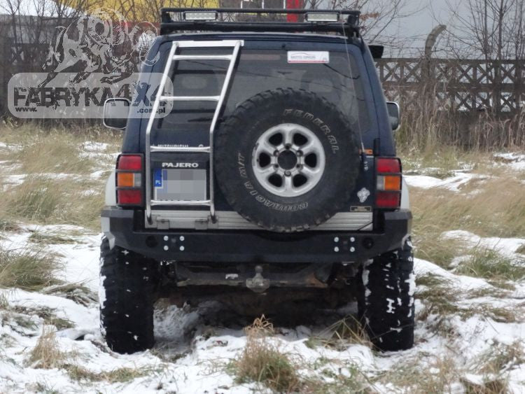 Rear bumper, short version with flares Mitsubishi Pajero II 91-99