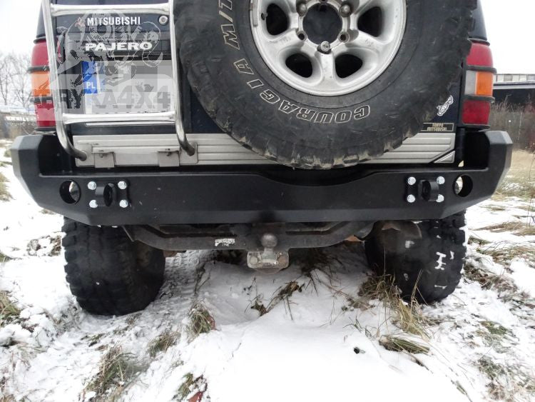 Rear bumper, short version with flares Mitsubishi Pajero II 91-99
