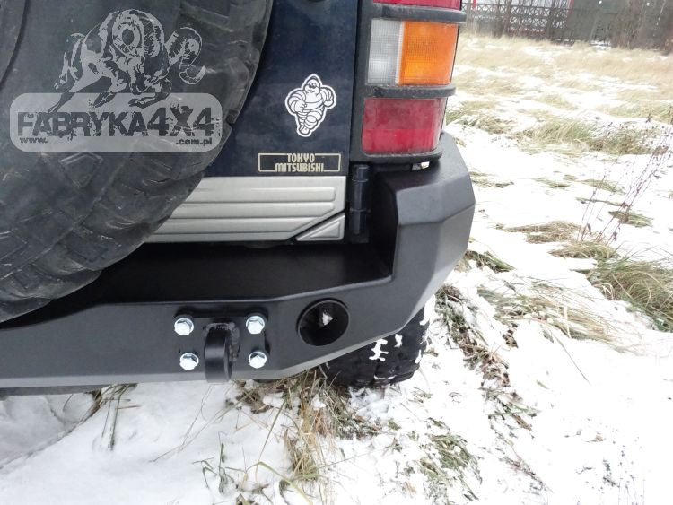 Rear bumper, short version with flares Mitsubishi Pajero II 91-99